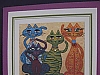 Four colorful cats